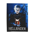 A high-quality micro fleece blanket featuring Pinhead from the 1987 movie Hellraiser holding the glowing Lament Configuration puzzle box against a dark blue background.