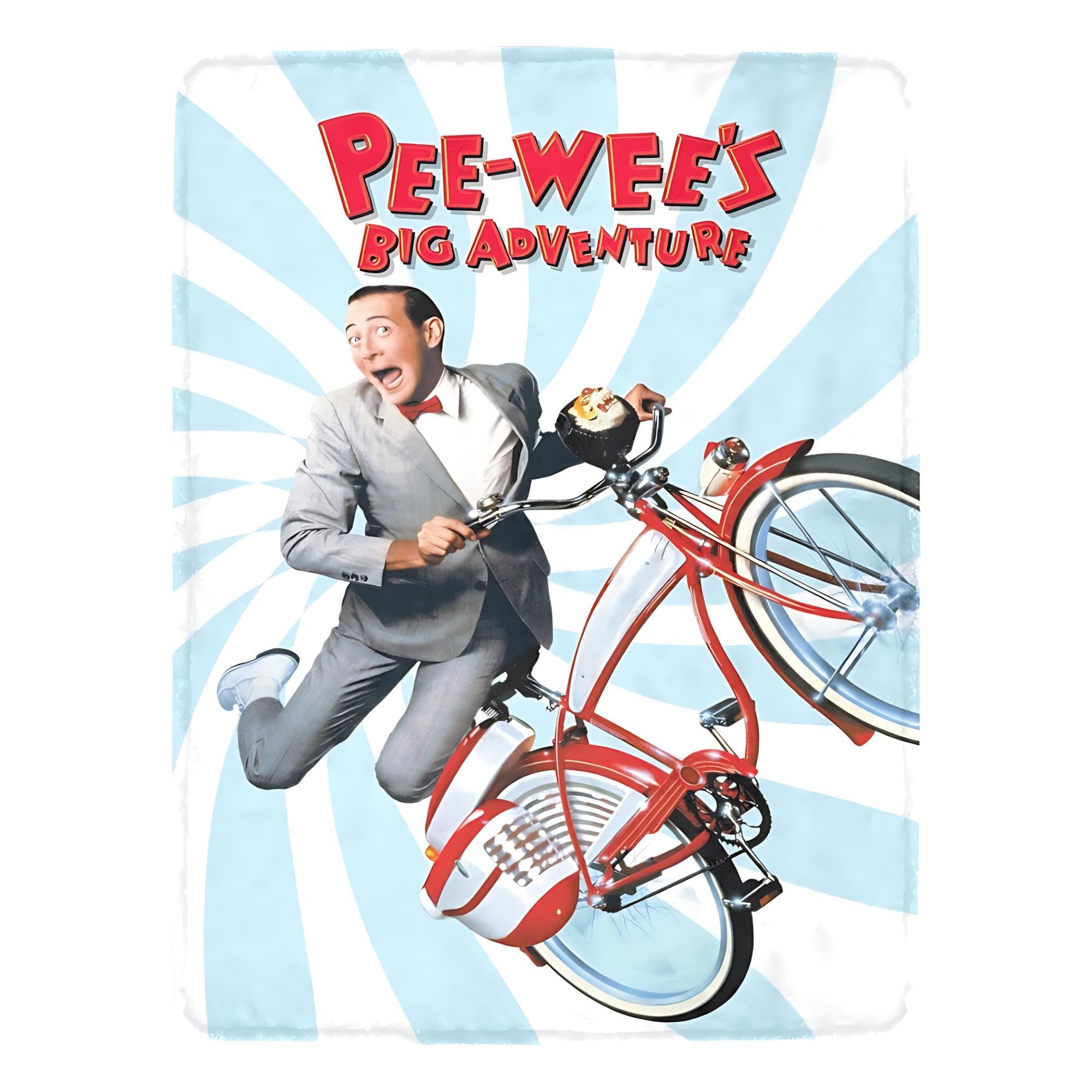 A premium soft fleece blanket featuring the Pee-wee's Big Adventure movie poster art with Pee-wee Herman riding his red bicycle over a light blue and white sunburst background.