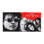 The Lost Boys beach towel featuring David and the vampire gang art with red and black movie logo.
