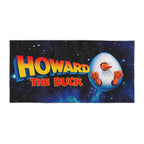 Vibrant beach towel featuring the Howard the Duck movie logo and an egg hatching against a starry space background.